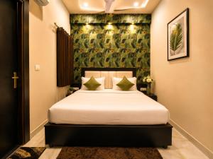 a bedroom with a bed in a room at Hotel Aaradhya Residency in Agra +28 photos