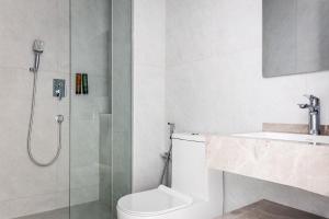 a bathroom with a shower and a toilet and a sink at Marmaris Saray Hotel DOWNTOWN in Tashkent +26 photos