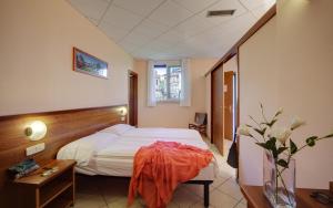Postel nebo postele na pokoji v ubytování Hotel Residence Zust