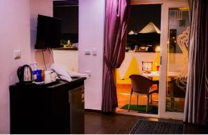 a kitchen with a table and a dining room at Golden Pyramids Inn in Cairo
