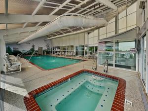 a large swimming pool in a building at Rock-a-While Whispering Pines 214 in Pigeon Forge +11 photos