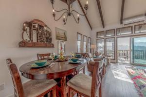 a dining room with a table and chairs at Hold Your Horses in Ruidoso