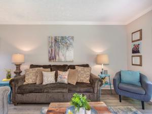 a living room with a couch and a chair at Lazy Bears Den 2103 in Pigeon Forge