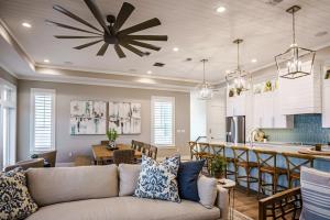 a living room with a couch and a kitchen at The Sanctuary in Padre Island