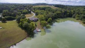 an aerial view of a house on an island in a lake at Sunrise Cove in Dandridge
