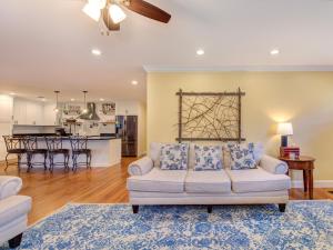 a living room with a couch and a kitchen at Sunrise Cove in Dandridge
