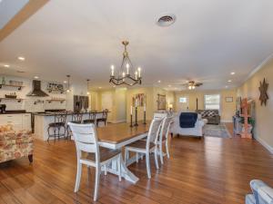 a dining room and kitchen with a table and chairs at Sunrise Cove in Dandridge +31 photos