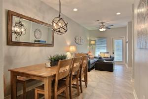 a dining room and living room with a table and chairs at Surfin Seahorse in Port Aransas
