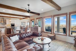 a living room with a couch and a table at Itll Do in Padre Island