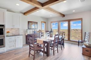 a kitchen with a dining room table and chairs at Itll Do in Padre Island