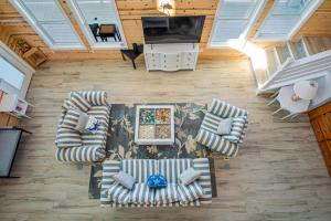 an overhead view of a living room with couches and a television at Ocean Spirit in Port Aransas