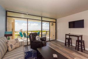 a living room with a couch and a table at Laguna Reef #208 - Sea Happiness in Rockport