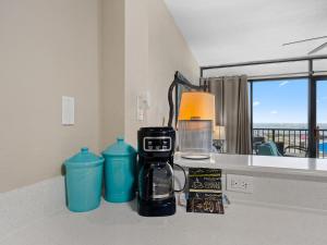 a coffee maker on a counter in a room at Laguna Reef #205 - La Las in Rockport