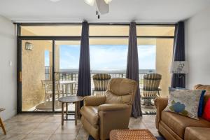 a living room with a couch and a chair at Laguna Reef #315 - Bayview Retreat in Rockport