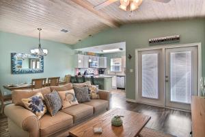 a living room with a couch and a kitchen at Just Beachy in Port Aransas
