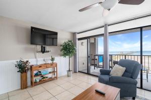 a living room with a view of the ocean at Laguna Reef #212 - Shore 2 Please in Rockport