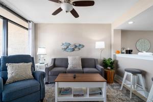 a living room with a couch and a ceiling fan at Laguna Reef #212 - Shore 2 Please in Rockport
