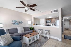 a living room with a couch and a ceiling fan at Laguna Reef #212 - Shore 2 Please in Rockport