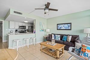 a living room with a couch and a table at Laguna Reef #308 - Beautiful Bay View in Rockport