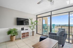 a living room with a view of the ocean at Laguna Reef #213 - Four Point Lighthouse in Rockport