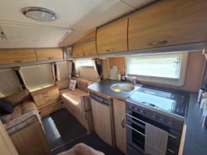 a small kitchen in an rv with a sink at Sterling Leisure in Ferryhill
