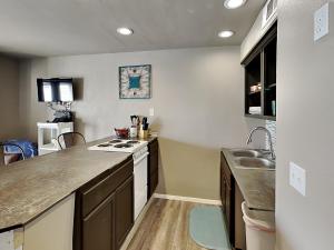 a kitchen with a sink and a counter top at Villa Del Sol #2138 in Corpus Christi