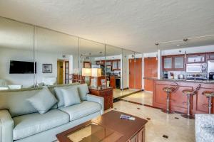 a living room with a couch and a table at San Luis 935-Luis Lookout in Galveston