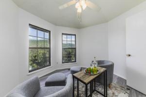 a living room with a couch and a table at Castle House in Ruidoso