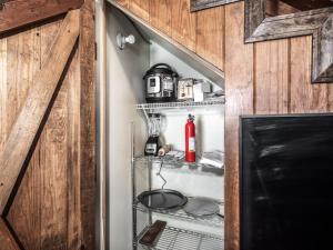 a refrigerator in a kitchen with its door open at Midtown Riverfront 2 in Ruidoso