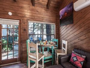 a dining room with a table and chairs at Midtown Riverfront 2 in Ruidoso