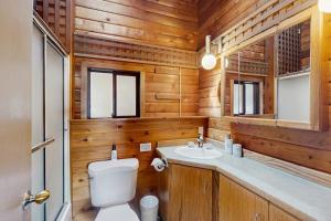a bathroom with a toilet and a sink at Sea Side Cedar in Langley