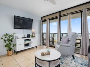 a living room with a tv and a couch and a table at LR 309 - Ms, Annies Oasis in Rockport