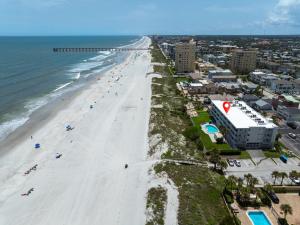 an aerial view of a beach with people on it at Jacksonville Beachdrifter 202 - Beach View in Jacksonville Beach