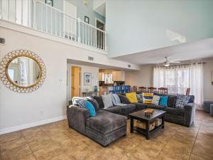 a living room with a couch and a table at La Dolce Vita Playa San Luis in Galveston
