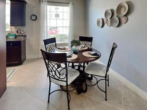 a dining room table and chairs in a kitchen at Dawn 315-saltwater Escape in Galveston