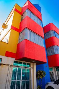 a colorful building with red yellow and blue at Hotel Oliveira in Goiânia