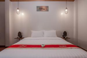 Postel nebo postele na pokoji v ubytování BB Angkor Residence