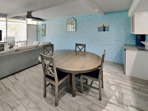 a dining room with a table and a couch at Sandy Shores in Port Aransas