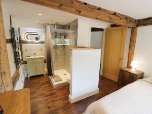 a bathroom with a shower and a sink in a room at Lower Tundridge Cottage in Suckley +71 photos