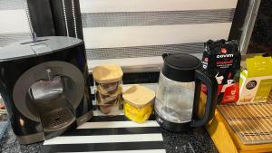 a coffee maker sitting on a counter next to a coffeemaker at Divna Pool&Garden 
