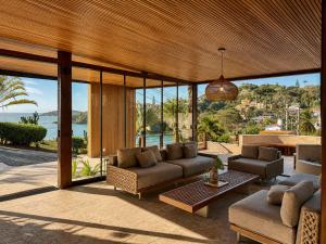 a living room with a couch and a table at HOTEL VILLE LA PLAGE & BEACH CLUB in Búzios