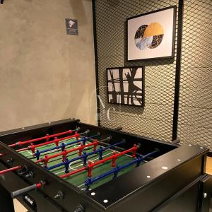 a large pool table with colorful rackets at RioDowntown Hub by RNC Flats in Rio de Janeiro