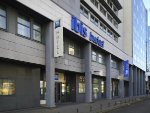 a big building with a sign on the side of it at ibis budget Tours Centre Gare et congrès in Tours