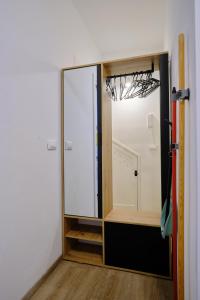 a room with a glass door and a mirror at Il Brigantino in Cori
