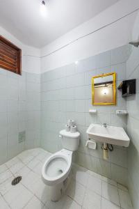 a bathroom with a toilet and a sink at Hotel Naxhiely in Puerto Escondido +37 photos