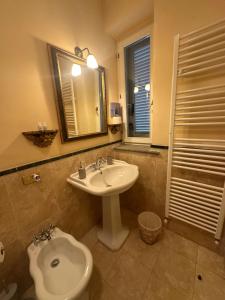 a bathroom with a sink and a toilet at B&B La Porticella in Viterbo +88 photos