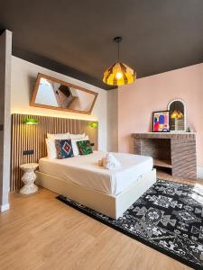 a bedroom with a large bed and a fireplace at CentralStay Tours Centre Gare - Ouverture Aout '26 in Tours +10 photos