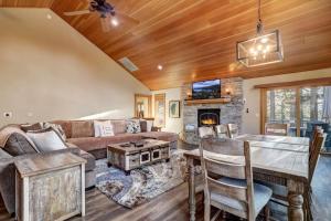 a living room with a couch and a table at On Tahoe Time - Pets Pool Table Game Room in South Lake Tahoe