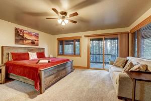 a bedroom with a bed and a ceiling fan at On Tahoe Time - Pets Pool Table Game Room in South Lake Tahoe