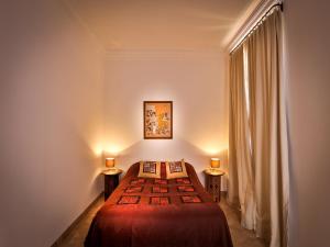 Un pat sau paturi într-o cameră la Riad Oasis 3